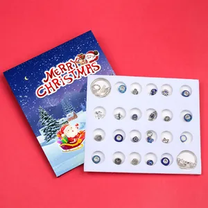 Blue Christmas advent calendar jewelry set with silver charms and festive gift box