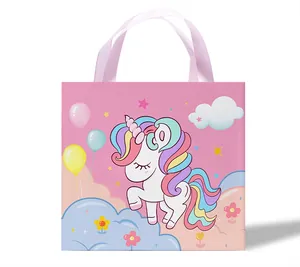 Pink gift bag featuring a cute rainbow unicorn illustration with satin ribbon handles