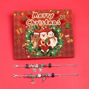 Detailed view of Christmas charm bracelet set with festive beads and red gift box