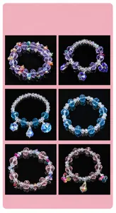 Close-up of colorful crystal bead bracelets with heart and flower pendants
