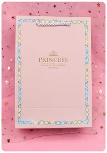 Elegant pink gift bag with golden Princess crown design and white rope handles
