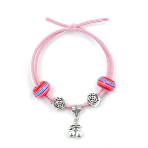 Pink elastic bracelet with cherry charm, striped beads and silver rose accents for kids
