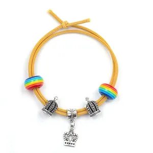 DIY yellow braided bracelet kit with rainbow beads and silver crown pendants for kids