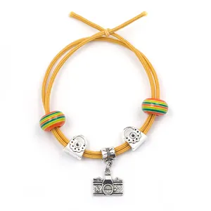 DIY handmade bracelet set with yellow elastic cords and vintage camera metal charms