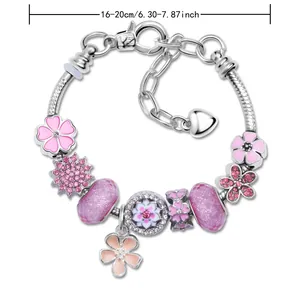 Roze bloemen bedelarmband in zilveren afwerking met verstelbare hart hanger van 16-20cm