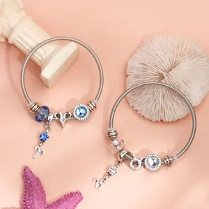 Silver zodiac stretch bracelets featuring Aries and Taurus charms with crystal beads