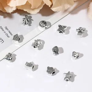 Lot de perles en alliage argenté vintage avec breloques étoile de mer, cœur et couronne
