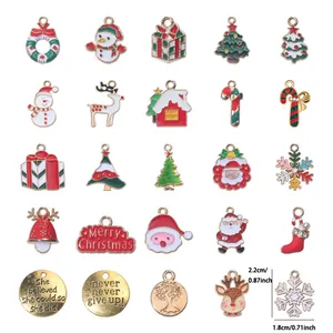 Macro detail of mixed enamel Christmas charms including Santa and festive trees