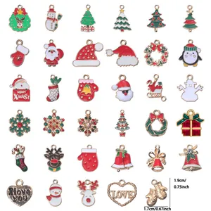 Detailed size view of mixed Christmas enamel charms including Santa and tree motifs