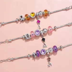 Three crystal zodiac charm bracelets with colorful glass beads on silver snake chains