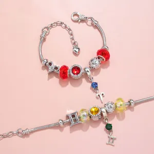 DIY constellation charm bracelets with red and yellow crystal beads and silver snake chains
