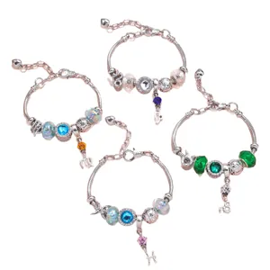 DIY charm bracelets with colorful crystal beads and zodiac pendants on silver snake chains