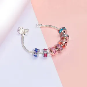 Detail of silver alloy snake chain bracelet with colorful pavé crystal charm beads