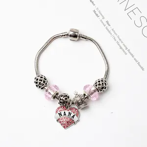 Bracelet à breloques rose et argent avec pendentif coeur NANA et petite couronne