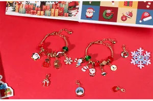 Detailed view of Christmas charm bracelet set with festive pendants on red background