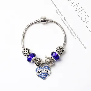 Bracelet chaîne serpent argenté avec perles bleues et breloque cœur NURSE