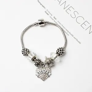 Bracelet argenté avec breloques cœur Sister, couronne et perles bleues