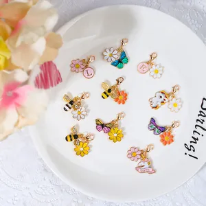 Charmante goudkleurige bijen- en madeliefjesbedels met karabijnsluiting voor DIY-sieraden