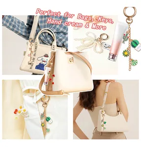 DIY enamel charm keychain set with cactus and floral pendants on stylish handbags
