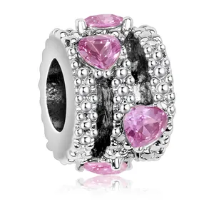 Silver bead charm with pink heart-shaped crystals and beaded edge for DIY jewelry
