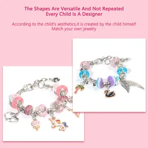 Detail of DIY charm bracelets featuring pink unicorn, heart, and angel wing pendants