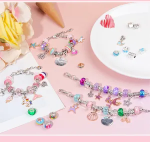 Detailed view of DIY bracelet set featuring colorful glass beads and unicorn charms