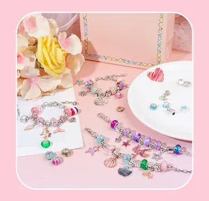 Detail of colorful charm beads set including unicorn pendants and enamel accessories