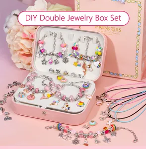 Pink double-layer jewelry box with assorted colorful charms and DIY bracelet accessories