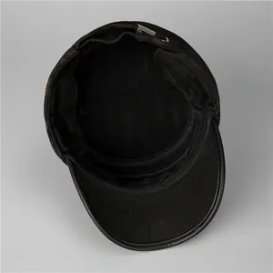Detail of winter flat cap showing breathable mesh lining and adjustable metal buckle