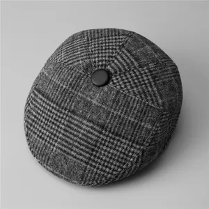 Classic grey checkered flat cap for men with warm wool-like texture and button top