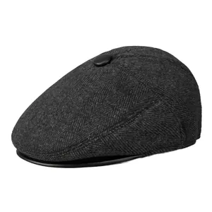 Men's winter grey herringbone flat cap with ear protection and faux leather brim detail