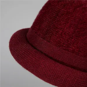 Women's burgundy cashmere knit winter hat with elegant rolled brim and warm plush texture