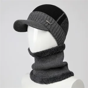 Detail of winter knit hat and neck warmer with thick faux fur lining and sport logo