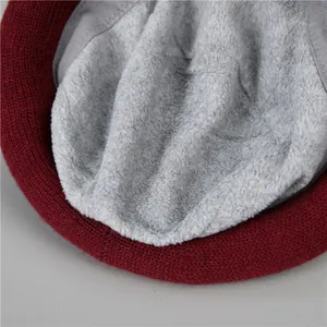Close-up of winter knit hat with thick grey fleece lining for warmth and comfort