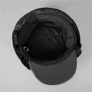 Detailed view of quilted thermal lining and faux fox fur trim on winter trapper hat