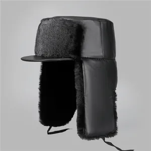 Detail view of winter black trapper hat with thick faux fur lining and ear flaps