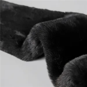 Close-up of thick black faux fur lining on a winter thermal trapper hat for elderly men