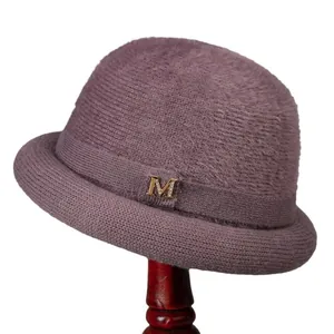 Elegant purple knit bucket hat for women with plush texture and rhinestone M logo detail