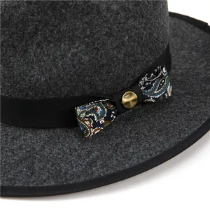 Dark grey wool fedora hat with paisley pattern bow and vintage gold button detail