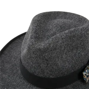 Dark grey wool fedora hat with a black paisley bow accessory in retro British style