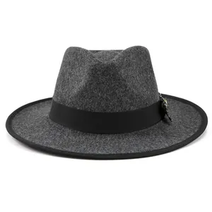 Detail of dark grey wool fedora hat featuring black grosgrain ribbon and feather pin
