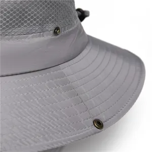 Detail of grey sun hat showing breathable mesh, reinforced brim stitching and metal snaps