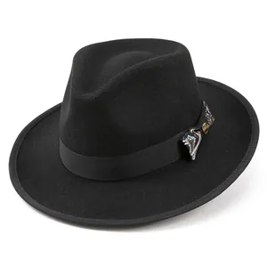 Detail of wool fedora hat featuring a black grosgrain ribbon and paisley pattern bow