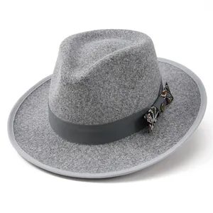 Detail of wool fedora with paisley bow ribbon and decorative golden metal buckle