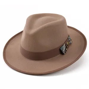 Detail of wool fedora hat featuring paisley print ribbon and vintage gold metal buckle