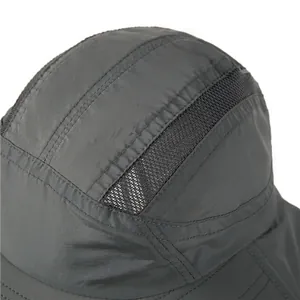 Close-up of quick-dry grey fabric and breathable mesh panels on outdoor sun hat