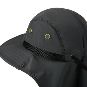 Detail of gray sun hat featuring side metal eyelets and breathable mesh ventilation