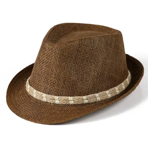 Detailed cross-weave texture of a dark brown straw fedora with a decorative cord band