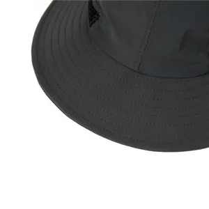 Detail of dark grey sun hat featuring reinforced brim stitching and breathable mesh panels