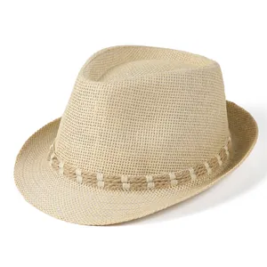 Close-up of beige straw fedora hat featuring woven rope band with white cross stitching